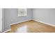 Cozy bedroom featuring pristine floors, neutral walls, and bright natural light from the window at 924 La Costa Cir # 4, Sarasota, FL 34237