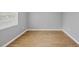 Bright bedroom boasting wood floors, fresh paint, and large window offering ample sunlight at 924 La Costa Cir # 4, Sarasota, FL 34237