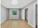 Bright bedroom with wood-look floors, neutral paint, and a large window for lots of natural light at 924 La Costa Cir # 4, Sarasota, FL 34237