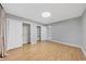A bedroom features wood-look flooring, neutral paint, and closet space at 924 La Costa Cir # 4, Sarasota, FL 34237