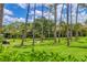 Beautifully landscaped community featuring lush green spaces, mature trees, and well-maintained grounds at 924 La Costa Cir # 4, Sarasota, FL 34237