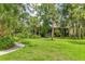 Lush landscaping surrounds residences with pathways and mature trees for serene living at 924 La Costa Cir # 4, Sarasota, FL 34237