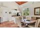 Inviting dining area features tile floors, a breakfast bar, large windows, and a kitchen with stainless steel appliances at 924 La Costa Cir # 4, Sarasota, FL 34237