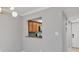 This kitchen features a serving window to the dining area with wood cabinets and granite countertops at 924 La Costa Cir # 4, Sarasota, FL 34237