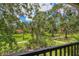 Scenic view from balcony showcasing mature trees, manicured lawns, and inviting pathways at 924 La Costa Cir # 4, Sarasota, FL 34237