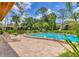 Inviting community pool area with chaise lounges on a brick paver deck, perfect for relaxing and enjoying the Florida sunshine at 924 La Costa Cir # 4, Sarasota, FL 34237
