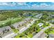 An aerial view shows the community featuring a pool, lush landscaping, golf course and serene lakes at 9580 High Gate Dr # 1822, Sarasota, FL 34238