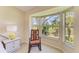Bay window with rocking chair overlooks the beautiful golf course at 9580 High Gate Dr # 1822, Sarasota, FL 34238