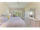 Bedroom featuring a bay window with golf course views at 9580 High Gate Dr # 1822, Sarasota, FL 34238