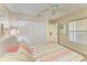 Bedroom features ample closet space and a ceiling fan at 9580 High Gate Dr # 1822, Sarasota, FL 34238