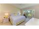 Bedroom with large windows overlooking a golf course at 9580 High Gate Dr # 1822, Sarasota, FL 34238