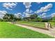 Bocce ball court surrounded by lush landscaping, perfect for outdoor recreation and social gatherings at 9580 High Gate Dr # 1822, Sarasota, FL 34238
