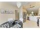 View of the dining area and into the kitchen with stainless steel refrigerator at 9580 High Gate Dr # 1822, Sarasota, FL 34238