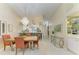 Dining room view showing the chandelier at 9580 High Gate Dr # 1822, Sarasota, FL 34238