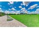 Scenic driving range with well-maintained grass and tee areas, perfect for practice and improving your golf swing at 9580 High Gate Dr # 1822, Sarasota, FL 34238