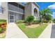 Charming condo exterior with a well-maintained lawn and screened in porch at 9580 High Gate Dr # 1822, Sarasota, FL 34238