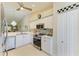 Clean kitchen with tile floors and white cabinets at 9580 High Gate Dr # 1822, Sarasota, FL 34238