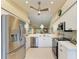 Stainless steel kitchen appliances with a view into the dining and living room at 9580 High Gate Dr # 1822, Sarasota, FL 34238