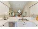 Bright kitchen with stainless steel appliances and views into the adjacent living area at 9580 High Gate Dr # 1822, Sarasota, FL 34238