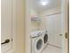 Laundry room with full-size washer and dryer at 9580 High Gate Dr # 1822, Sarasota, FL 34238