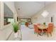 Open-concept living space with dining area and sliding glass doors to a patio at 9580 High Gate Dr # 1822, Sarasota, FL 34238