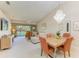 Open-concept living area with dining space at 9580 High Gate Dr # 1822, Sarasota, FL 34238