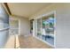 Charming outdoor patio with tile flooring and sliding glass doors at 9580 High Gate Dr # 1822, Sarasota, FL 34238