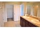 Bathroom with double sinks, ample cabinet space, and a walk-in closet at 10019 Geese Trail Cir, Sun City Center, FL 33573