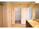 Bathroom with double sinks, ample cabinet space, and walk-in closets at 10019 Geese Trail Cir, Sun City Center, FL 33573
