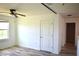 Bedroom with wood-look floors and ceiling fan at 10019 Geese Trail Cir, Sun City Center, FL 33573