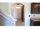 Inviting entryway featuring tiled floors, an archway, and a sliding barn door at 10019 Geese Trail Cir, Sun City Center, FL 33573