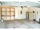 Spacious garage with storage shelves at 10019 Geese Trail Cir, Sun City Center, FL 33573