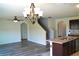 Open-concept living room that connects to the kitchen and stairwell at 10019 Geese Trail Cir, Sun City Center, FL 33573