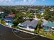 Stunning aerial view showcasing the backyard pool and boat dock on waterfront property at 1031 Contento St, Sarasota, FL 34242