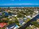 Aerial view of waterfront property with a backyard pool and dock in a coastal community at 1031 Contento St, Sarasota, FL 34242