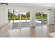 Bright living area featuring sliding glass doors to an outdoor pool deck at 1031 Contento St, Sarasota, FL 34242