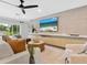 Stylish living room with chic decor, a large flat-screen TV, and plush seating at 1031 Contento St, Sarasota, FL 34242