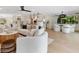 Open-concept living space featuring modern furniture and an open view of the kitchen and dining room at 1031 Contento St, Sarasota, FL 34242