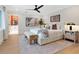 Spacious main bedroom with ensuite bath, neutral decor, and stylish furnishings at 1031 Contento St, Sarasota, FL 34242
