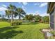 Backyard featuring well manicured lawn and water view in a lovely setting at 11221 Sandhill Preserve Dr, Sarasota, FL 34238