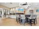 Modern community bar featuring stylish barstools, a decorative backsplash, and pendant lighting at 11221 Sandhill Preserve Dr, Sarasota, FL 34238