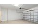 Empty garage with painted walls features an automatic door for easy access to your vehicle at 11221 Sandhill Preserve Dr, Sarasota, FL 34238