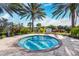 View of the outdoor hot tub area surrounded by trees, plants, and greenery at 11221 Sandhill Preserve Dr, Sarasota, FL 34238