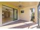 A screened lanai offers tile flooring, ceiling fan, and access to the home's interior at 11221 Sandhill Preserve Dr, Sarasota, FL 34238