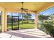 Enclosed patio features a brick floor, beautiful view, and an outdoor ceiling fan at 11221 Sandhill Preserve Dr, Sarasota, FL 34238