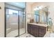 Elegant bathroom showcasing a walk-in shower, vanity with granite countertop, and tasteful decor at 12398 Keyridge Loop, Largo, FL 33778