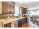 Well-appointed kitchen with stainless steel appliances, granite countertops and hardwood floors at 12398 Keyridge Loop, Largo, FL 33778