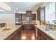 Beautiful kitchen with stainless steel appliances, granite countertops, and dark wood cabinets at 12398 Keyridge Loop, Largo, FL 33778