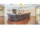 Spacious living room boasts hardwood floors, recessed lighting, and cozy fireplace at 12398 Keyridge Loop, Largo, FL 33778