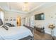 Spacious main bedroom with hardwood floors, decorative lighting, and lots of natural light at 12398 Keyridge Loop, Largo, FL 33778